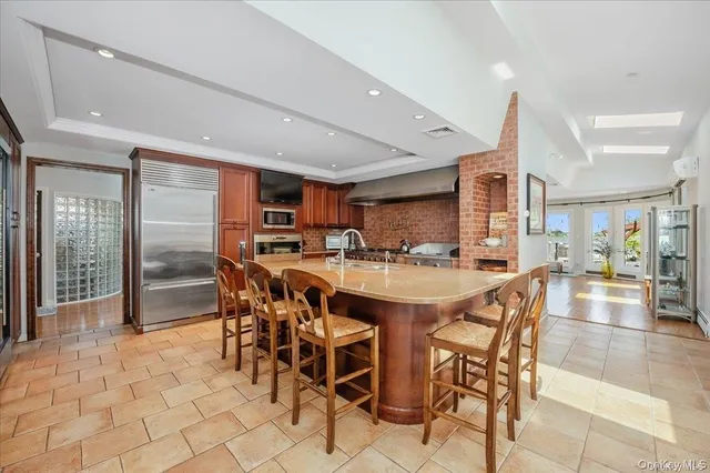 a kitchen with stainless steel appliances granite countertop a sink and cabinets