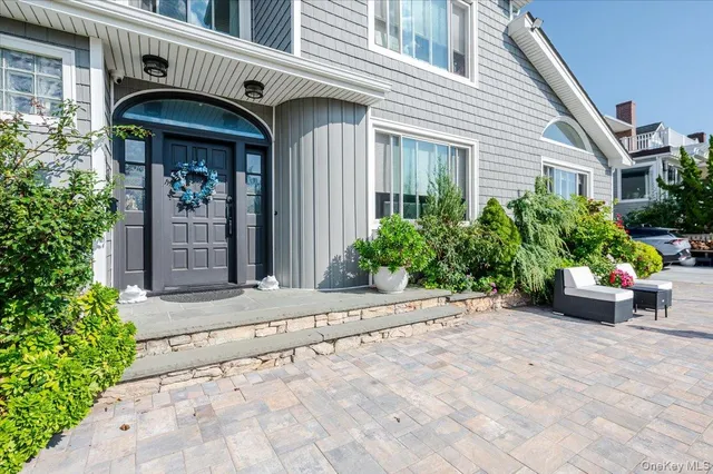 a view of house with yard and lake view