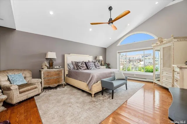 a bedroom with a large bed and a couch