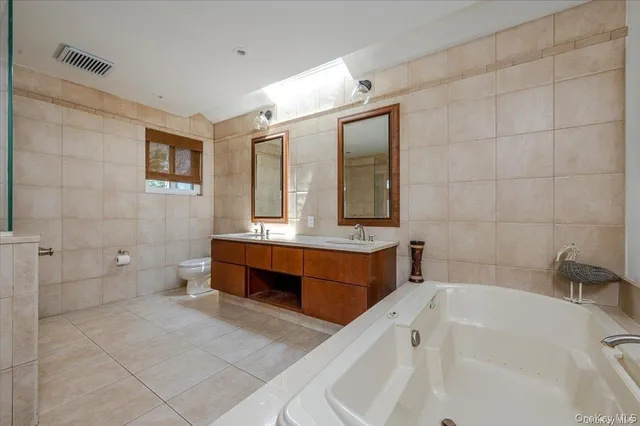 a bedroom with furniture and a wooden floor