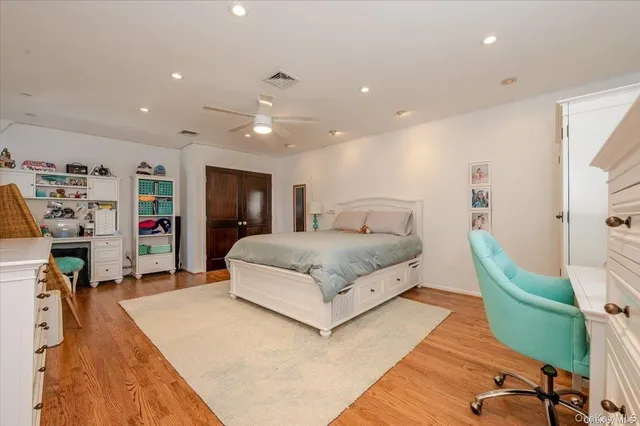 a bathroom with a granite countertop sink a mirror and a shower