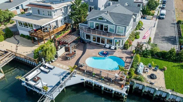 a view of a patio with table and chairs and potted plants
