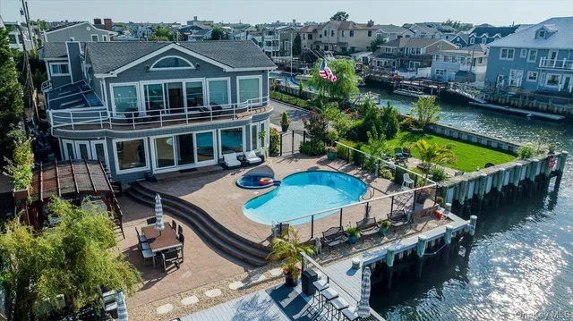 a front view of houses with yard