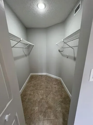 a view of a room with racks on the wall