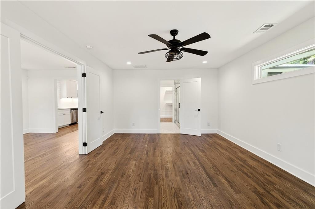 1344 Midlawn Drive Decatur, GA 30032 - Photo 50 of 87 a view of empty room with wooden floor and ceiling fan