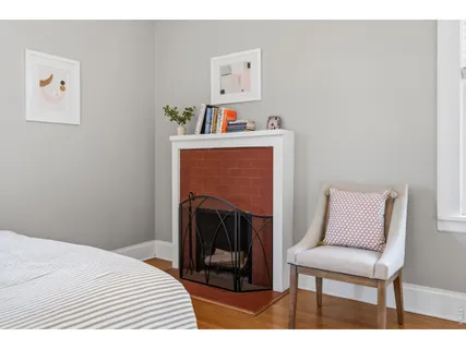 a bedroom with a bed and a chair