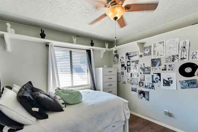 a bedroom with bed and cabinets