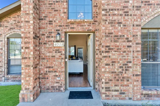 a view of living room with a brick wall