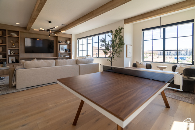 5366 Cyan Lane St. George, UT 84790 - Photo 26 of 39 Dining space featuring beamed ceiling, light wood finished floors, a chandelier, and built in features