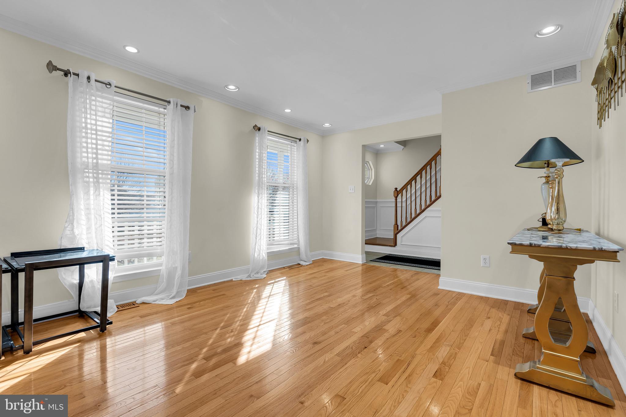 12 Fawn Hollow Road Burlington, NJ 08016 - Photo 11 of 47 a view of a room with wooden floor staircase and a fireplace