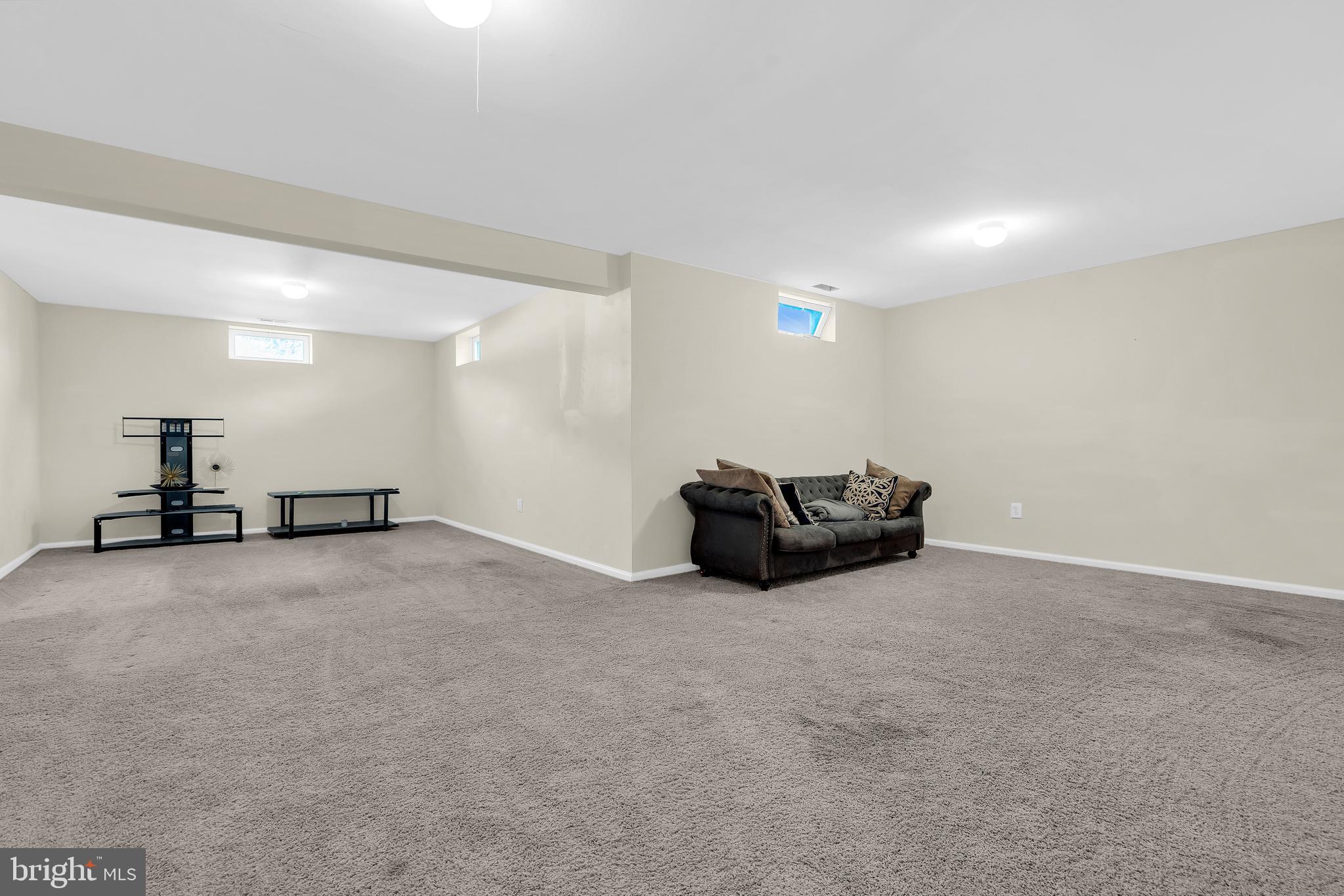12 Fawn Hollow Road Burlington, NJ 08016 - Photo 38 of 47 a big room with wooden floor and windows