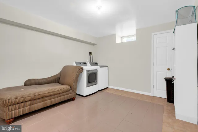 a living room with furniture and white walls