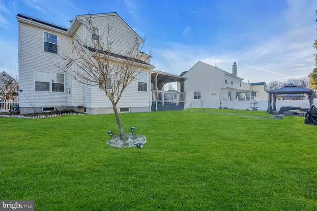 a front view of house with a garden