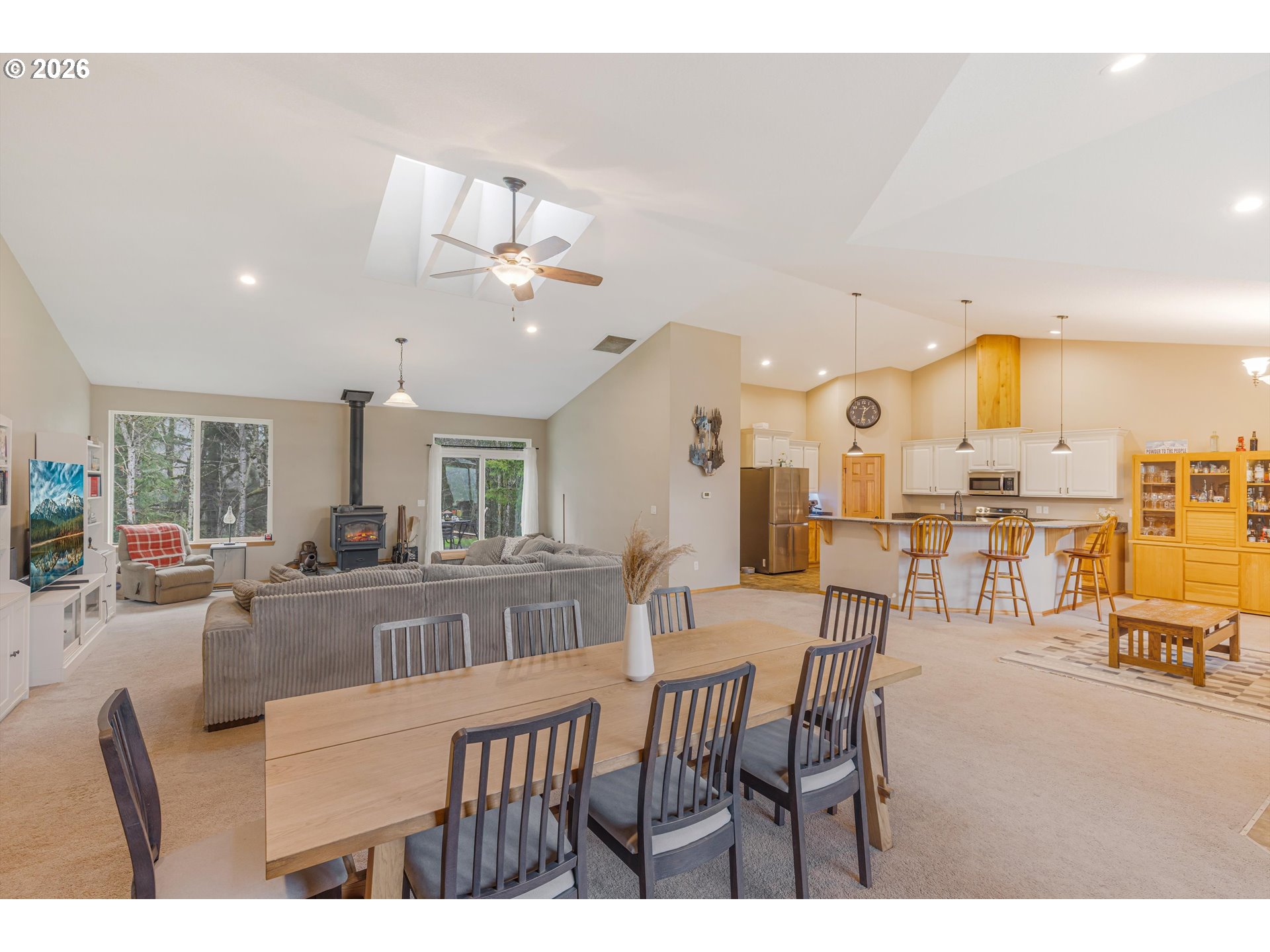 52365 Northwest Scofield Road Buxton, OR 97109 - Photo 11 of 48 a view of a dining hall with furniture and a large window