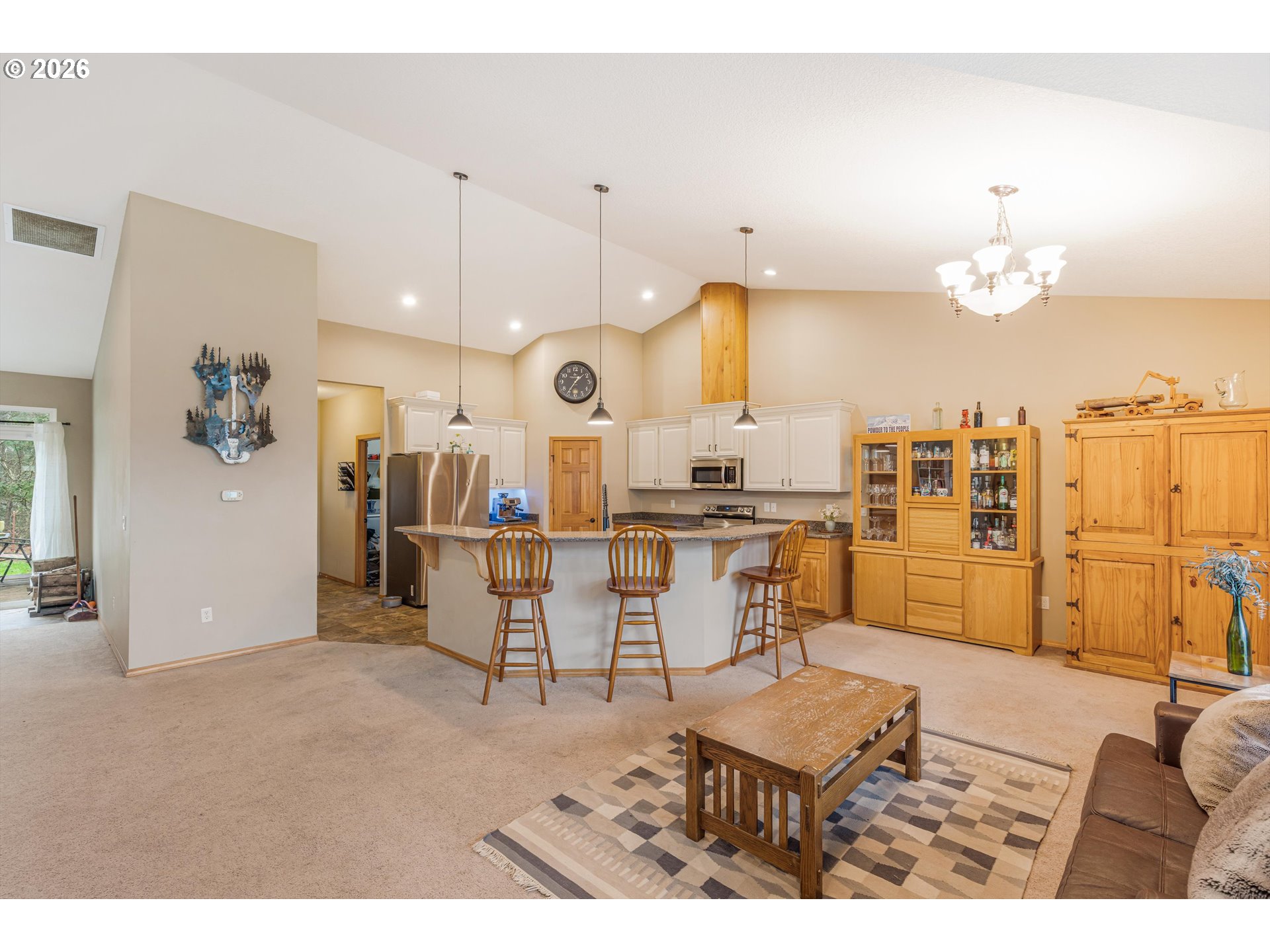 52365 Northwest Scofield Road Buxton, OR 97109 - Photo 17 of 48 a living room with lots of furniture and view of kitchen