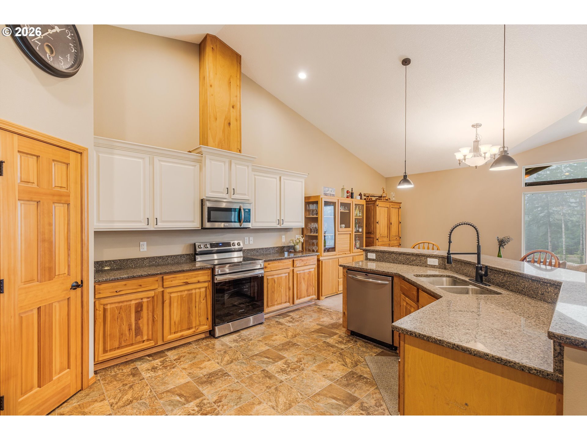 52365 Northwest Scofield Road Buxton, OR 97109 - Photo 19 of 48 a kitchen with stainless steel appliances granite countertop a sink a stove and a refrigerator