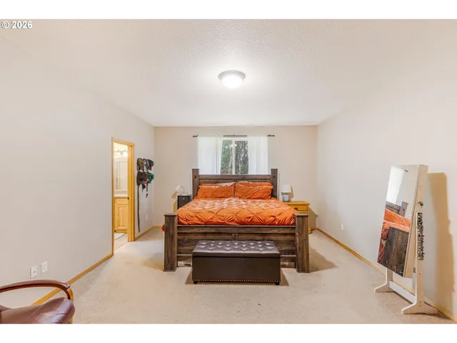 a room with furniture and mirror