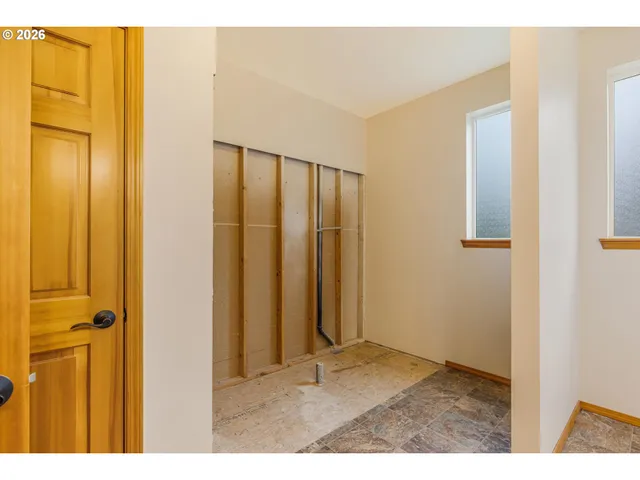 a view of an entryway with wooden floor