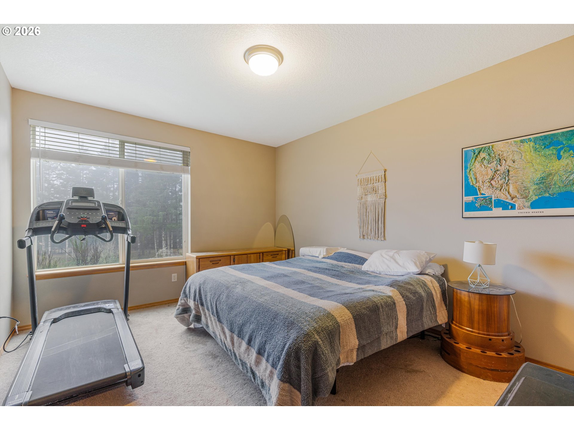 52365 Northwest Scofield Road Buxton, OR 97109 - Photo 31 of 48 a bedroom with a bed and wooden floor