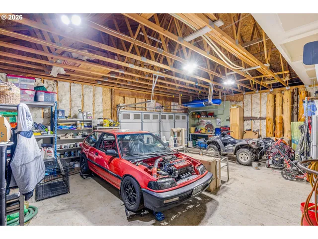 a living room with lots of furniture and a chandelier