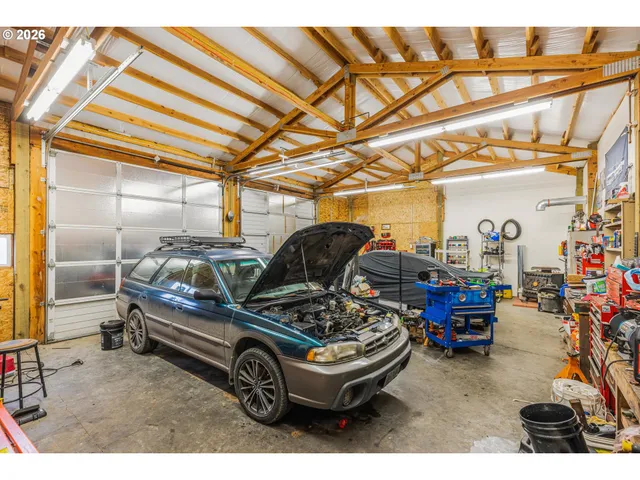a car and bike parked in a garage