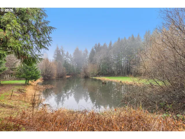 a view of a lake with a yard