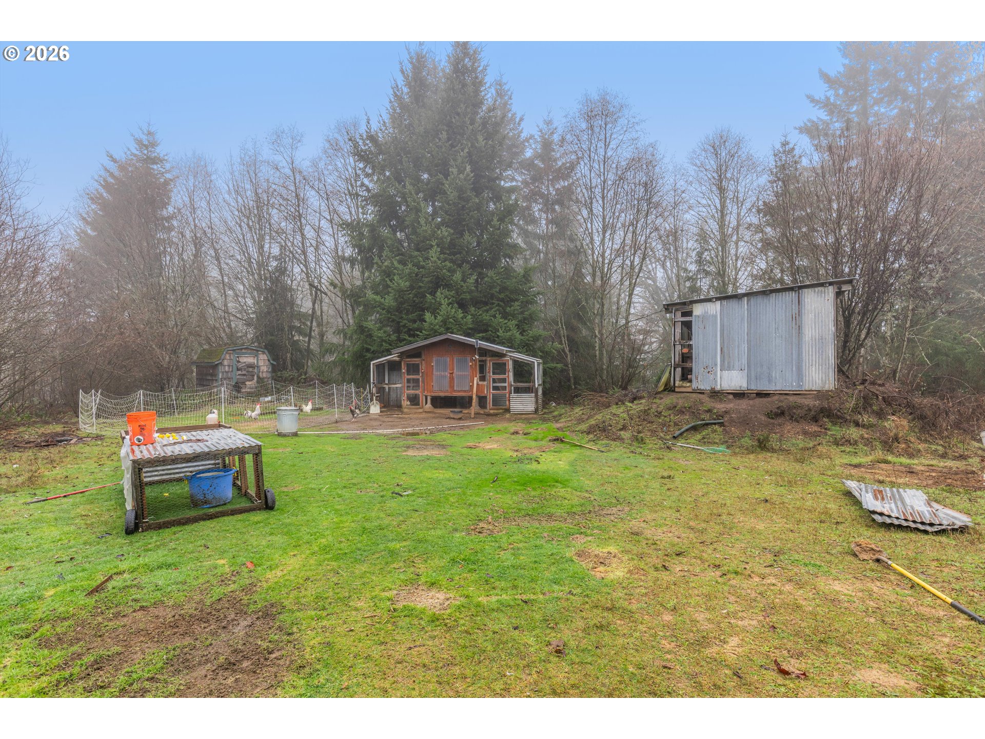 52365 Northwest Scofield Road Buxton, OR 97109 - Photo 10 of 48 a backyard of a house with table and chairs