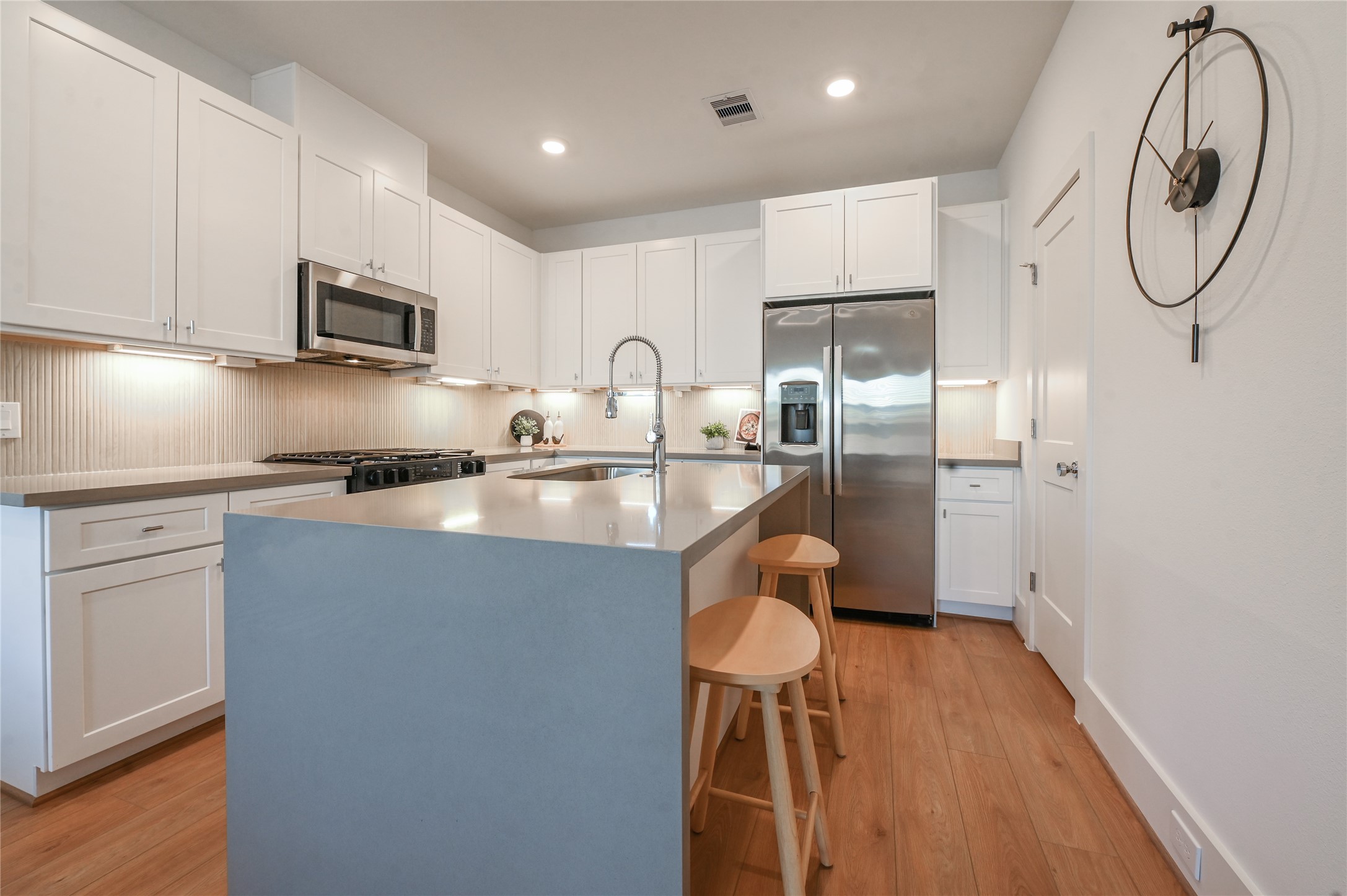 7607 Victory Reserve Street Houston, TX 77088 - Photo 15 of 50 a kitchen with stainless steel appliances a refrigerator sink and microwave