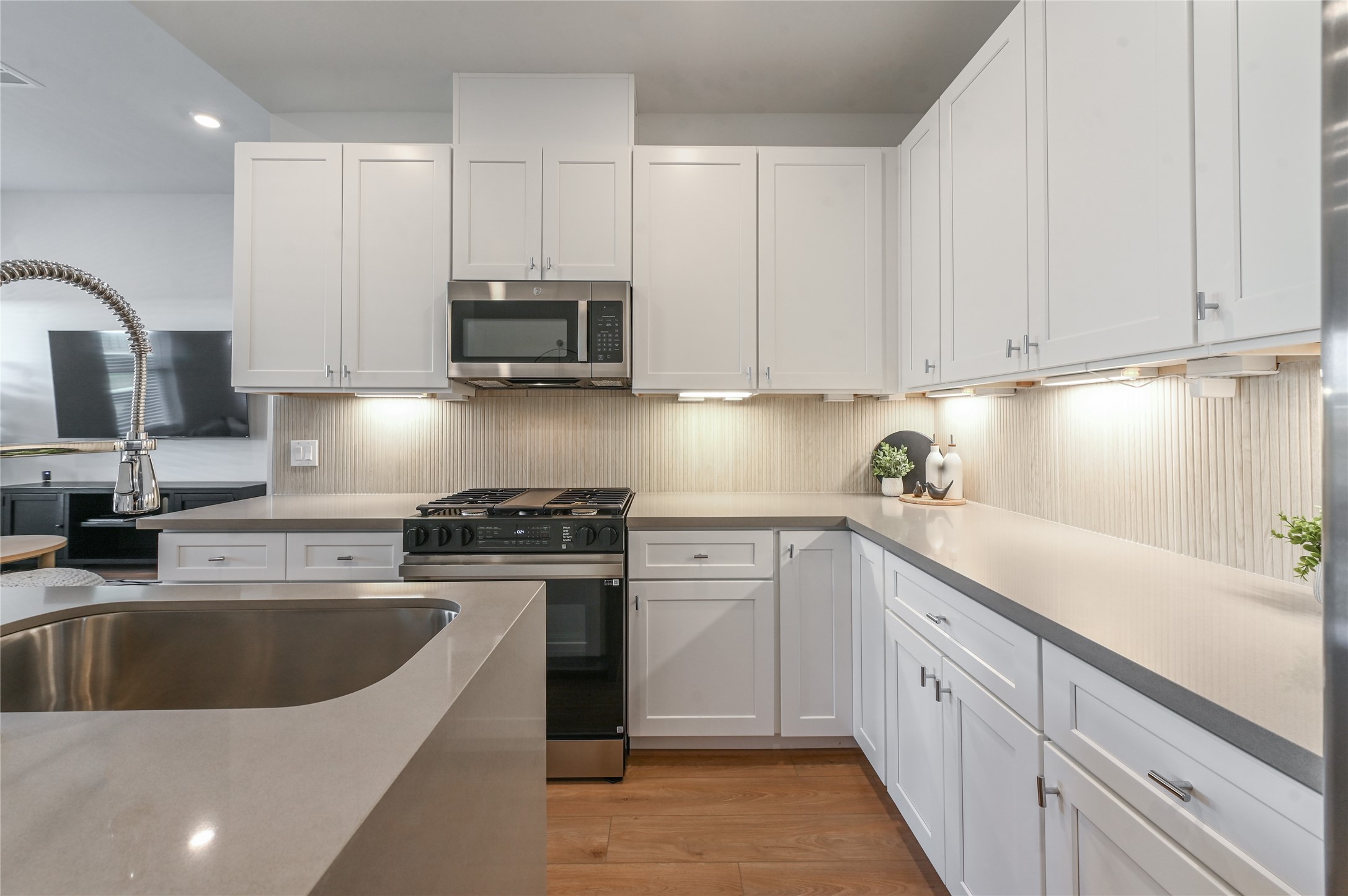 7607 Victory Reserve Street Houston, TX 77088 - Photo 17 of 50 a kitchen with stainless steel appliances granite countertop a sink stove and cabinets