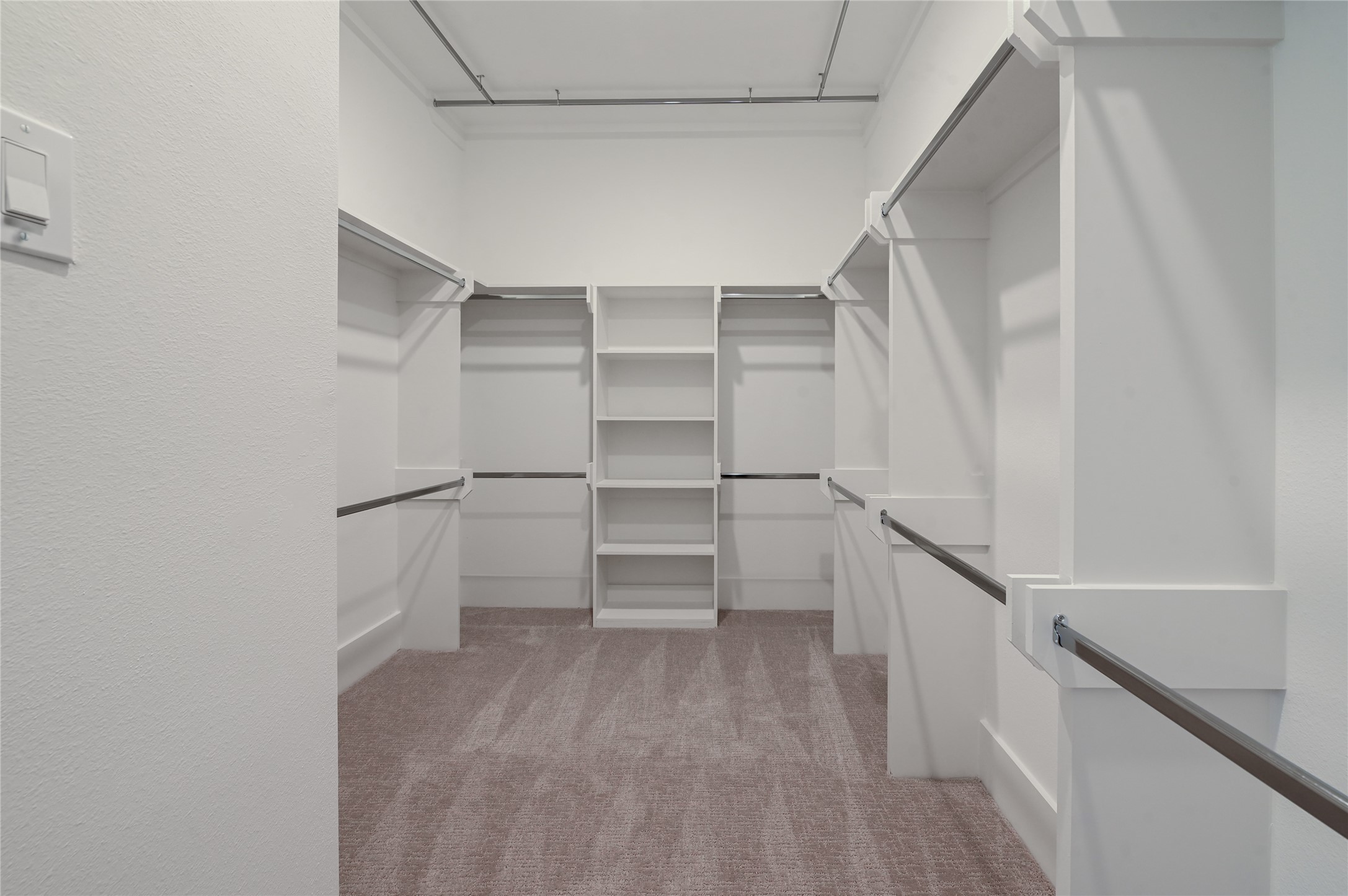 7607 Victory Reserve Street Houston, TX 77088 - Photo 27 of 50 a view of walk in closet with empty racks