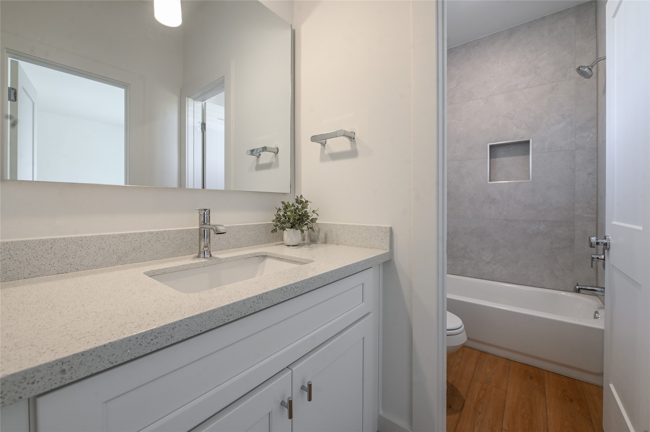 7607 Victory Reserve Street Houston, TX 77088 - Photo 40 of 50 a bathroom with a sink a toilet and shower