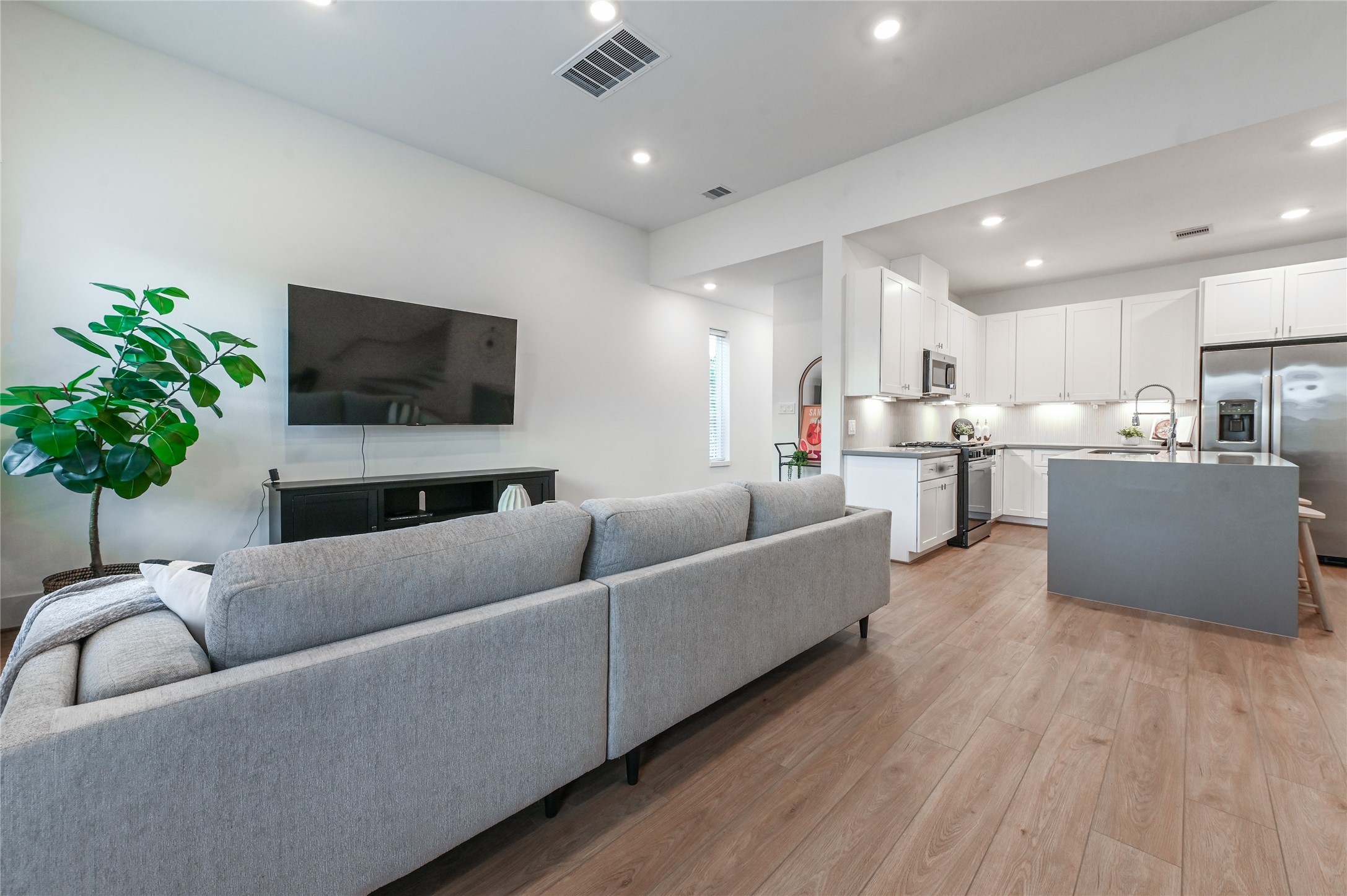7607 Victory Reserve Street Houston, TX 77088 - Photo 9 of 50 a living room with furniture and a flat screen tv