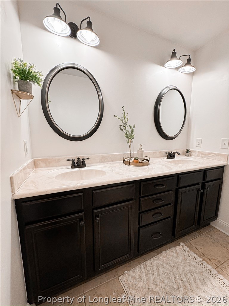 93 Falcon Ridge Drive Spring Lake, NC 28390 - Photo 32 of 50 a bathroom with a double vanity sink and a mirror