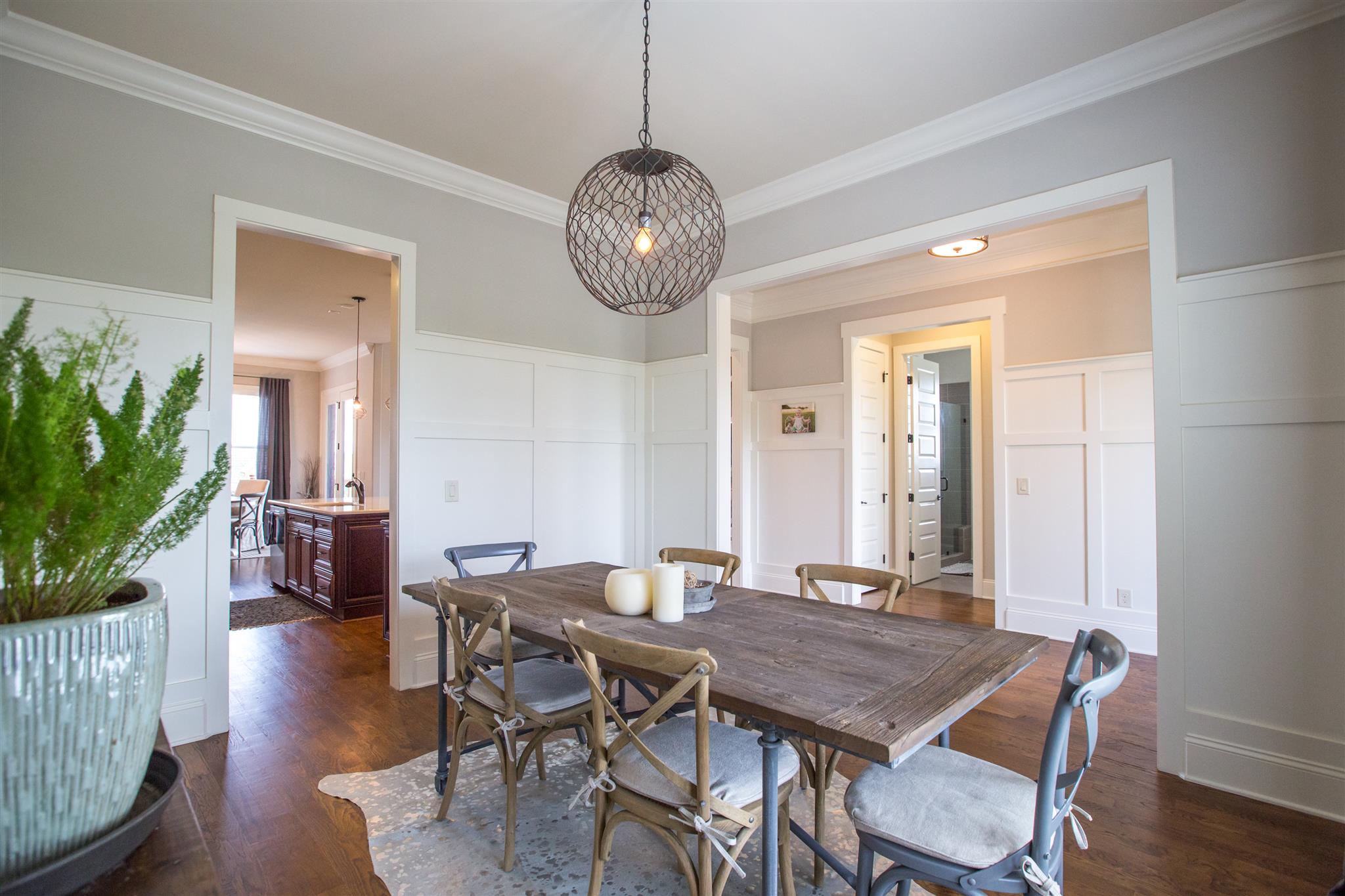 100 Truman Road West Franklin, TN 37064 - Photo 2 of 24 a view of a dining room with furniture wooden floor and a chandelier