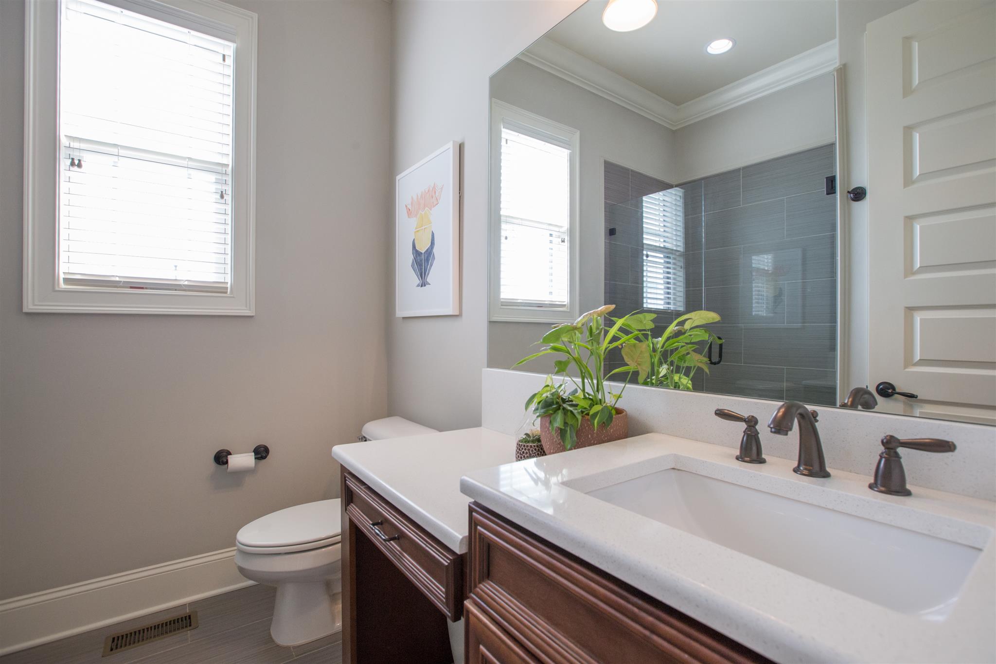 100 Truman Road West Franklin, TN 37064 - Photo 13 of 24 a bathroom with a granite countertop toilet sink and mirror