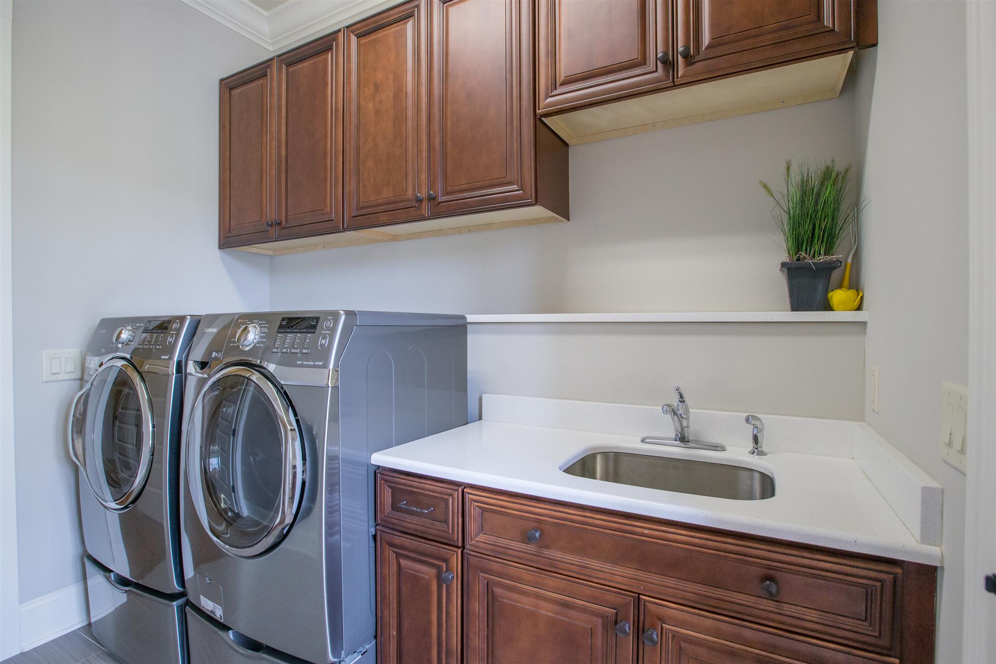 100 Truman Road West Franklin, TN 37064 - Photo 16 of 24 a utility room with sink dryer and washer