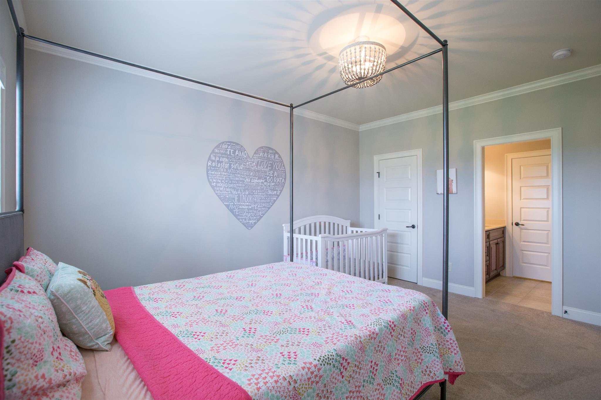 100 Truman Road West Franklin, TN 37064 - Photo 17 of 24 a bedroom with a bed and a chandelier