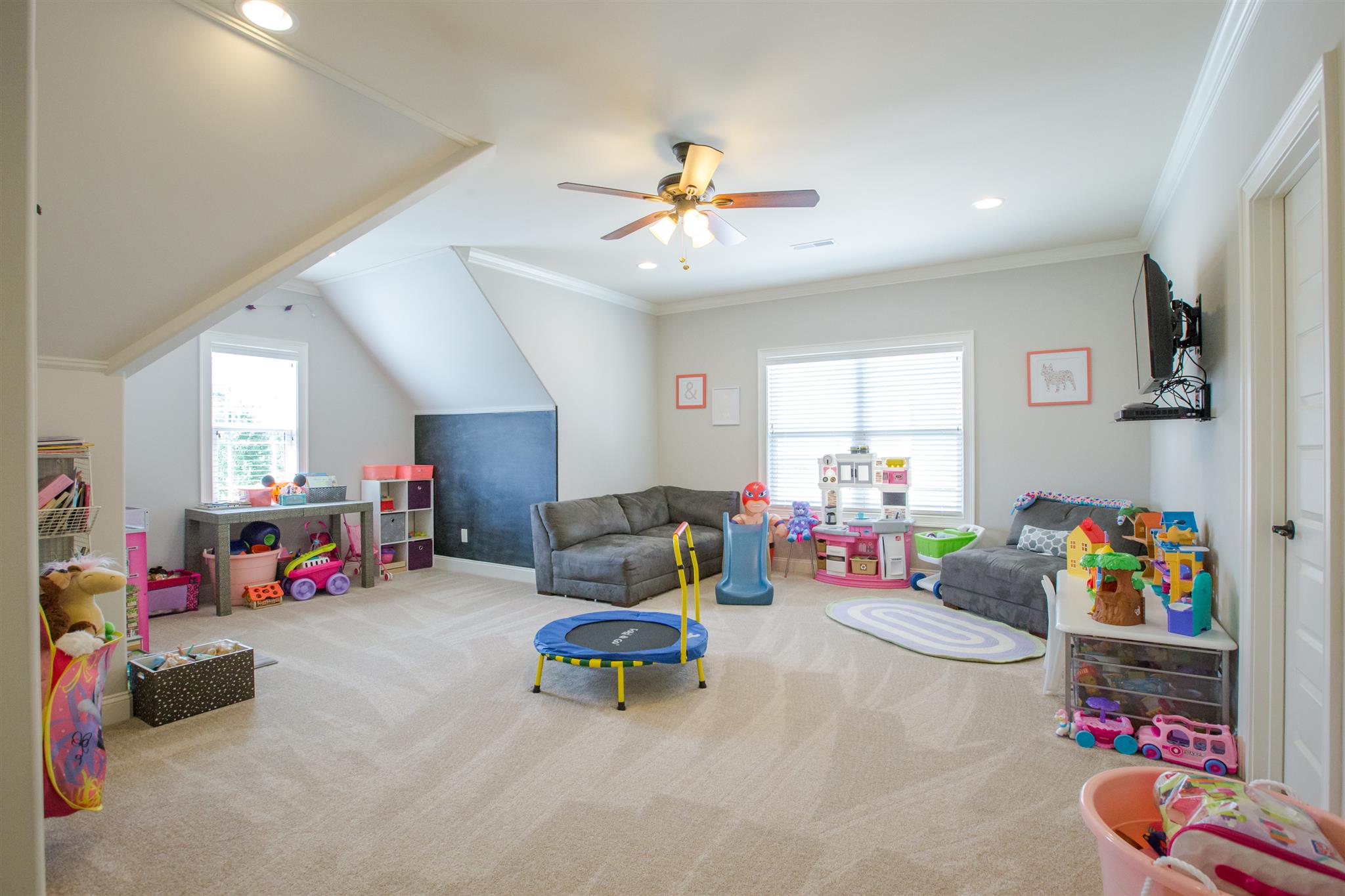 100 Truman Road West Franklin, TN 37064 - Photo 20 of 24 a living room with lots of furniture and a flat screen tv