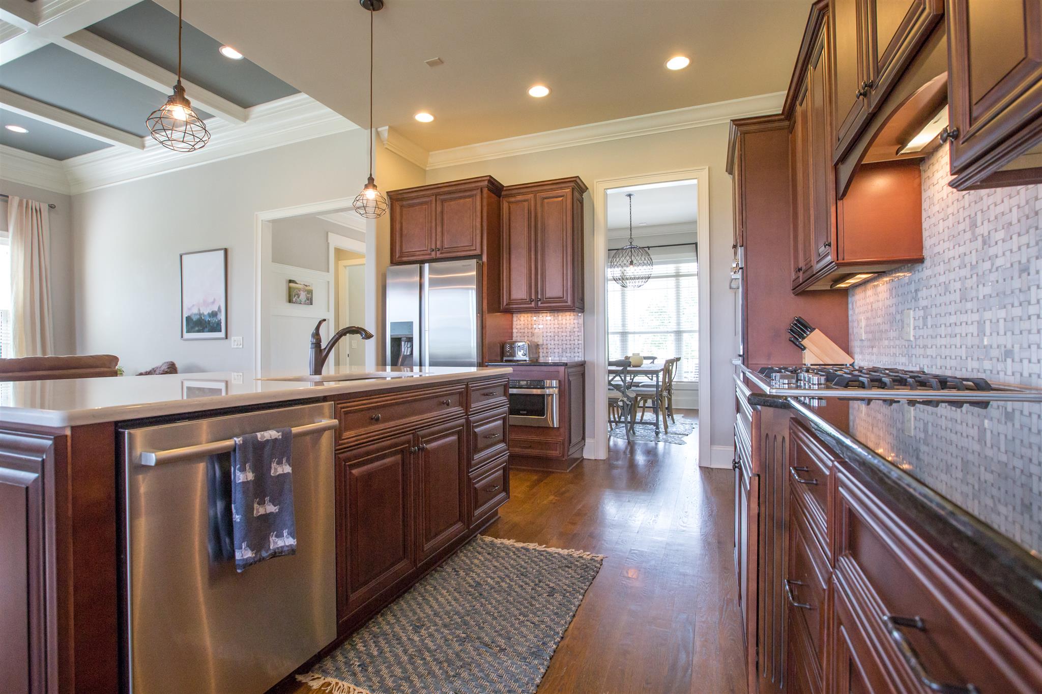 100 Truman Road West Franklin, TN 37064 - Photo 5 of 24 a large kitchen with stainless steel appliances granite countertop a stove a sink dishwasher and a refrigerator