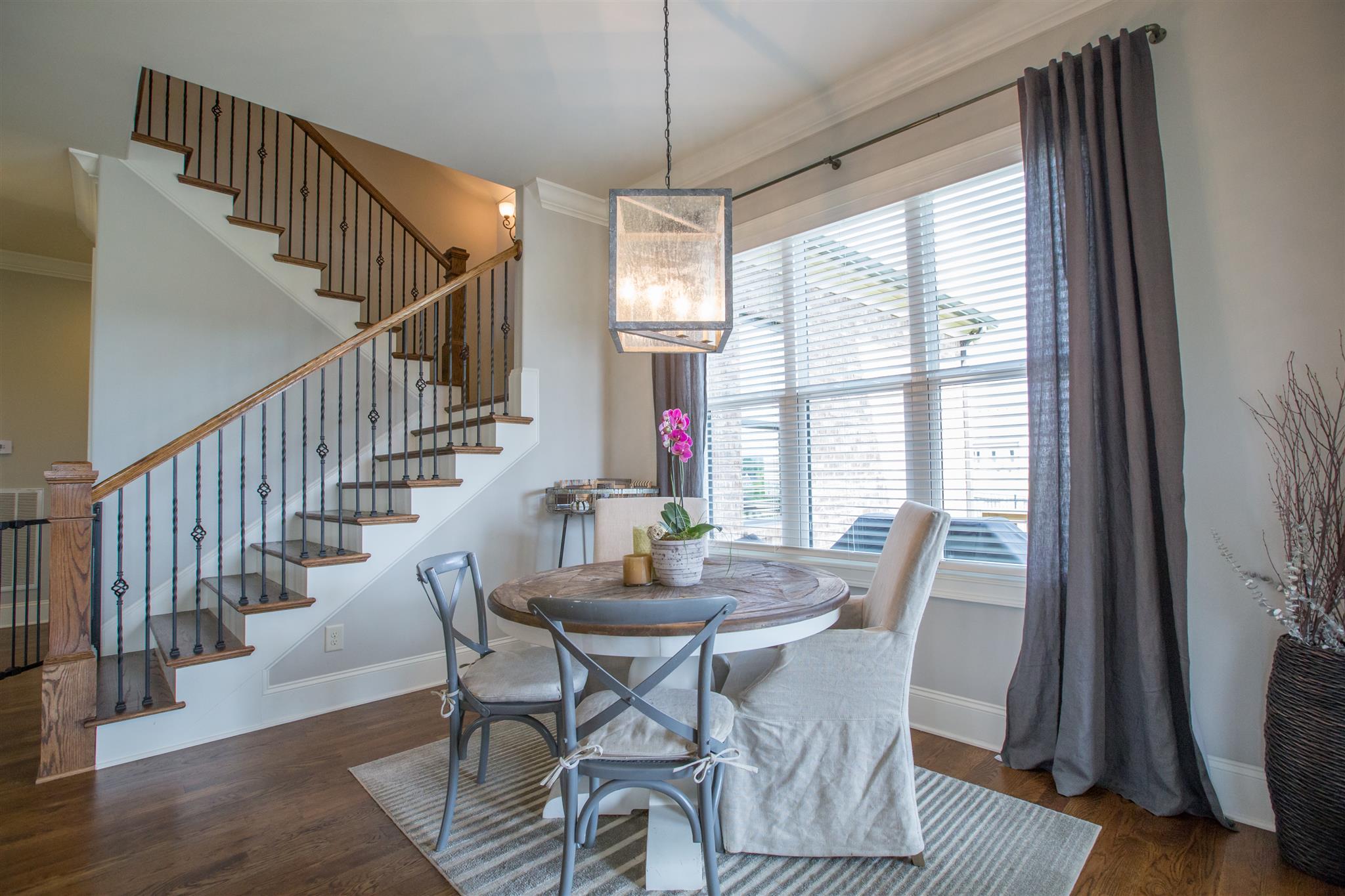 100 Truman Road West Franklin, TN 37064 - Photo 6 of 24 a view of a dining room with furniture window and wooden floor