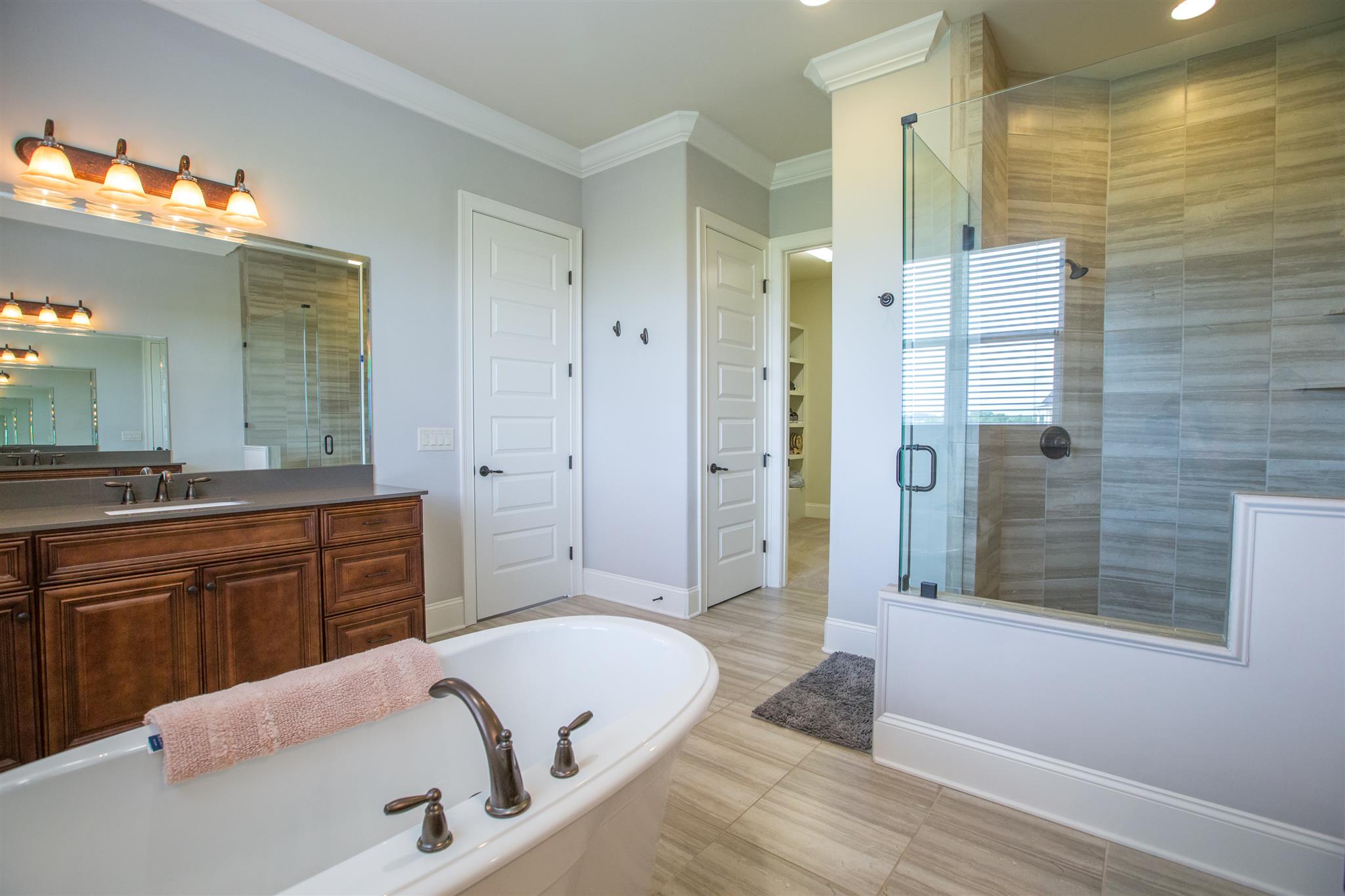 100 Truman Road West Franklin, TN 37064 - Photo 10 of 24 a bathroom with a granite countertop tub sink shower and mirror