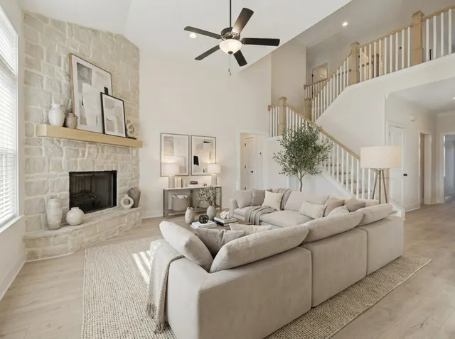 a living room with furniture and a fireplace