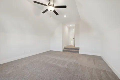 a spacious bathroom with a granite countertop sink and a mirror