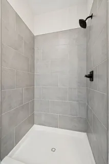 a bathroom with a granite countertop sink a toilet and a mirror