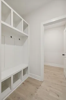 a view of walk in closet with empty racks
