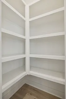 a kitchen with stainless steel appliances a sink a stove and cabinets