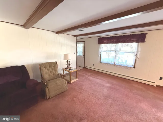 an empty room with window and stairs