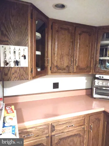 a kitchen with a stove and a refrigerator