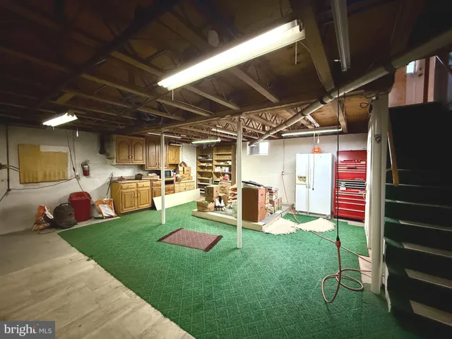 a backyard of a house with a yard and outdoor seating