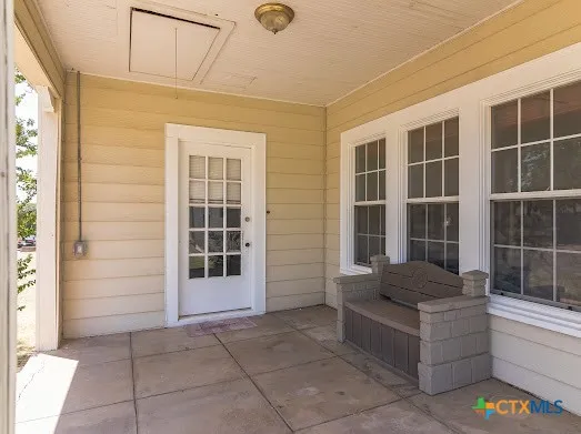 a front view of a house with a large window